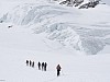 The group touring through beautiful glacier terrain.